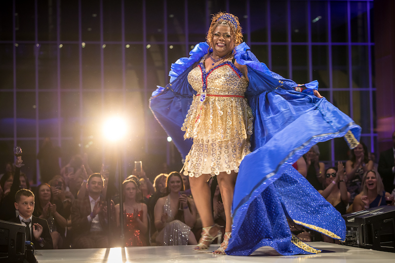 A model and cancer survivor walks the Bra Couture KC runway